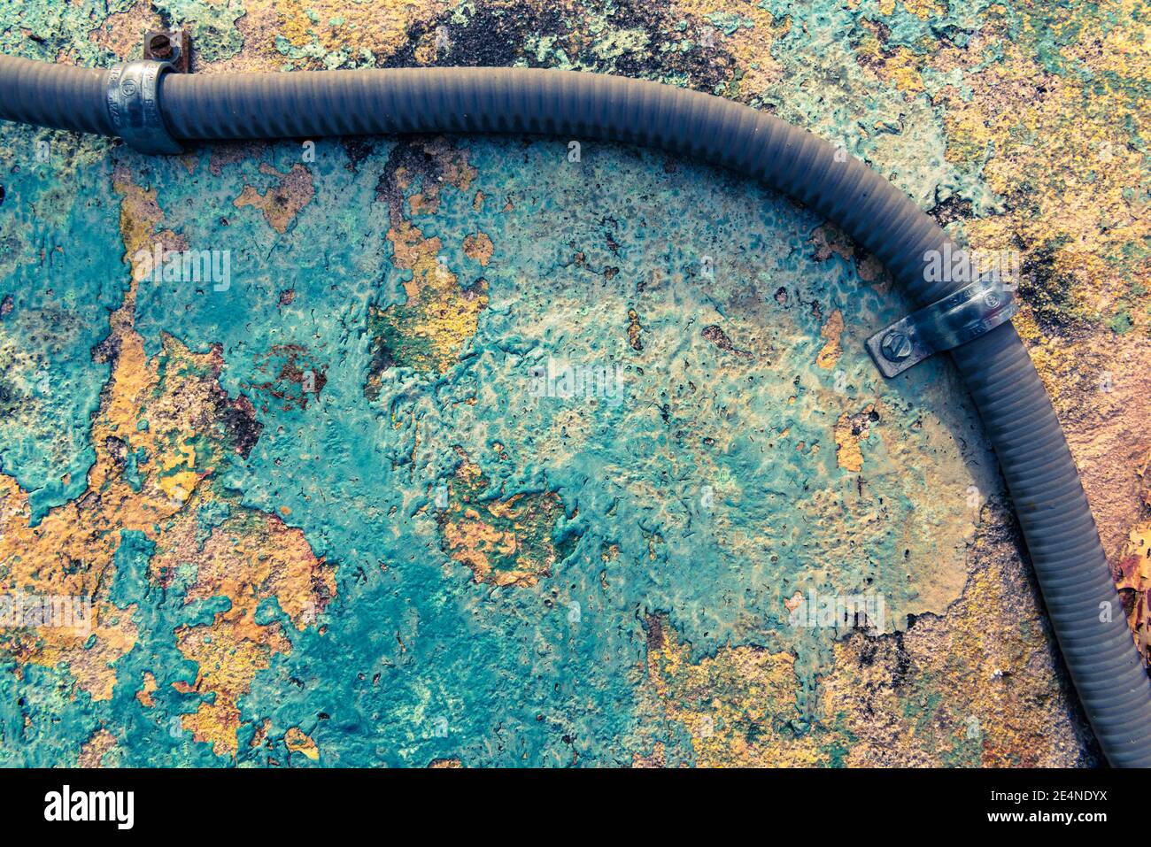 blue painted concrete with electrical conduit Stock Photo Alamy