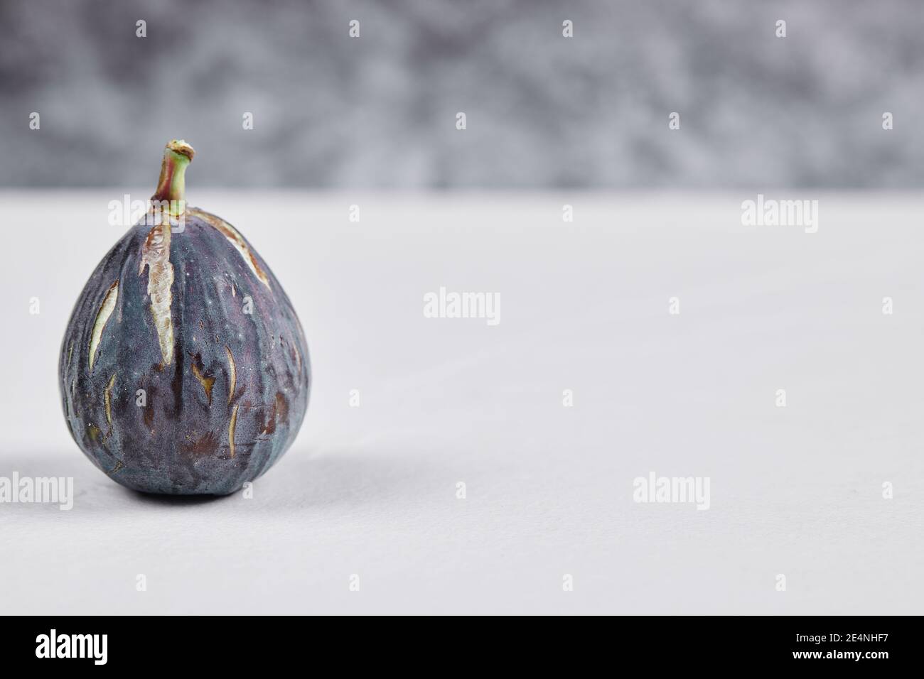Fresh ripe fig on a white background Stock Photo