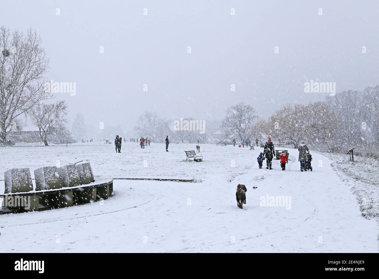 People enjoying heavy snow along Thames towpath, Sadlers Ride, Hurst Park, East Molesey, Surrey, England, Great Britain, United Kingdom, UK, Europe Stock Photo