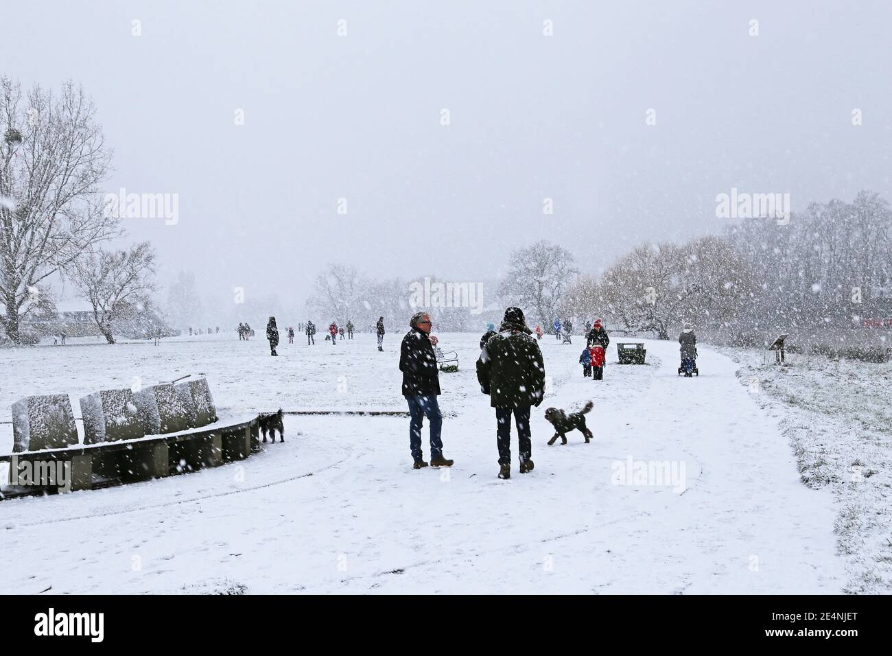 People enjoying heavy snow along Thames towpath, Sadlers Ride, Hurst Park, East Molesey, Surrey, England, Great Britain, United Kingdom, UK, Europe Stock Photo