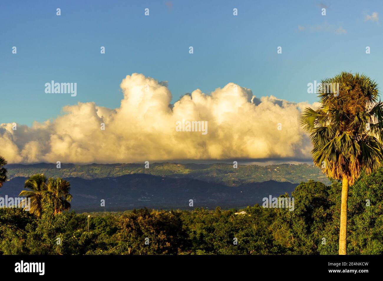 The Cordillera Septentrional mountains, mantled with puffy white clouds