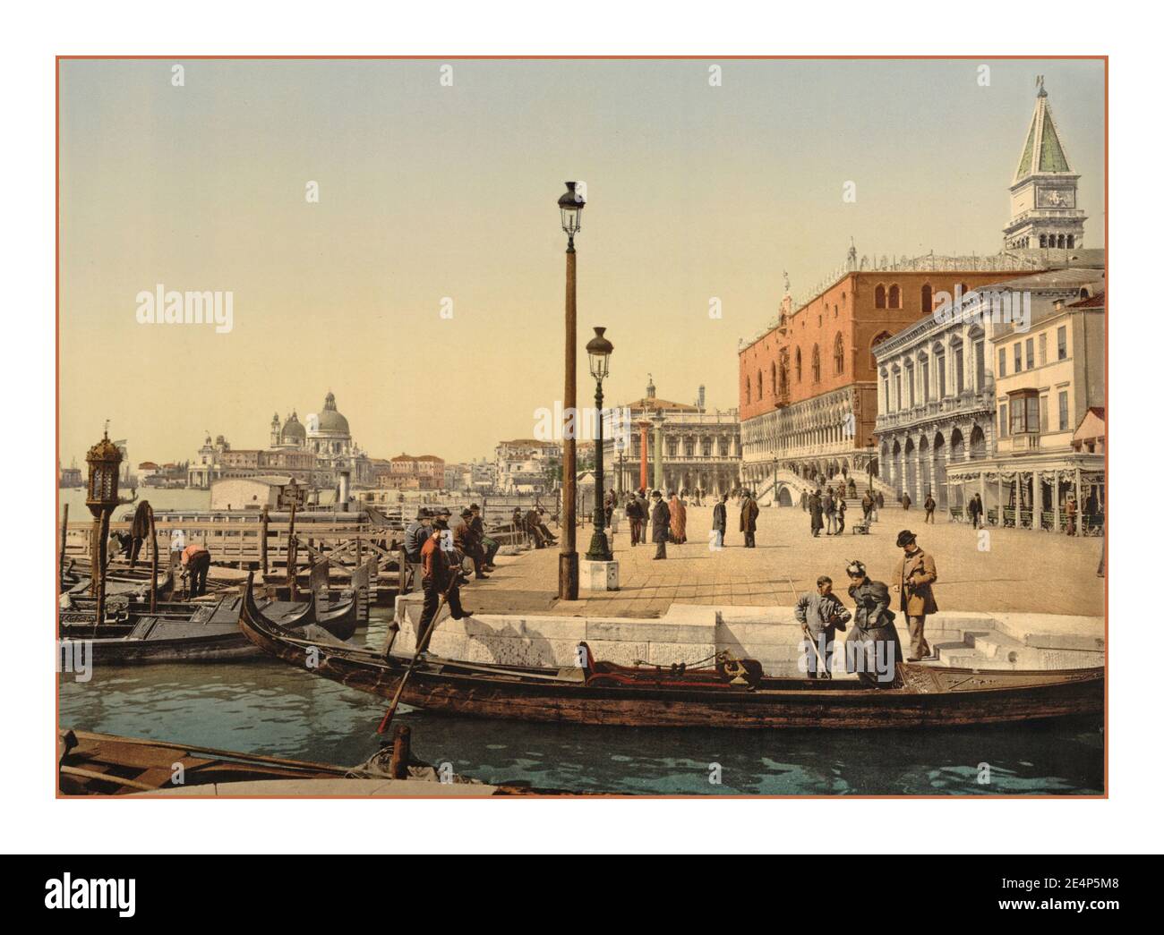 VENICE PHOTOCHROM Vintage 1900’s Old retro Venice front of  Doges' Palace, Santa Maria della Salute Church of Salute Old Historic Venice, Italy- Photochrom 1900 with Gondola and Gondolier in foreground Venice Italy Stock Photo