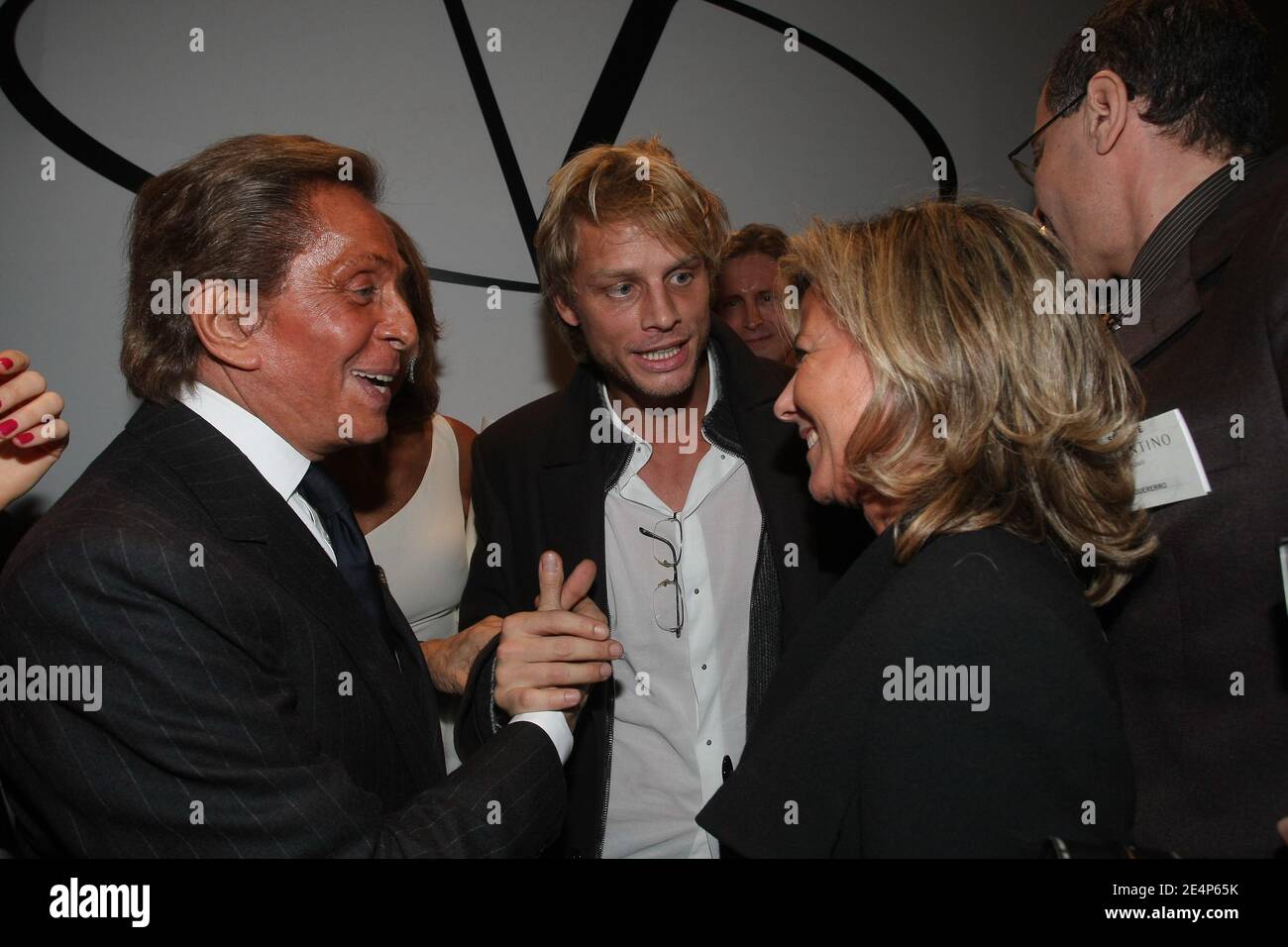 Valentino with Claire Chazal and her boyfriend Arnaud Lemaire backstage  after his Spring-Summer 2008 Haute-Couture show, held at the Musee Rodin in  Paris, France, on January 23, 2008. 75-year-old Valentino retires after