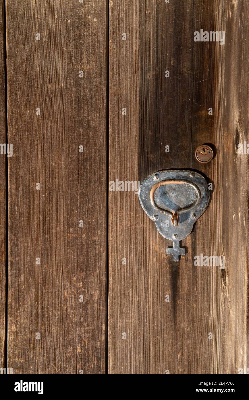 Old lock at the Russian Fort  church  with a cross on wooden copy-space and door Stock Photo