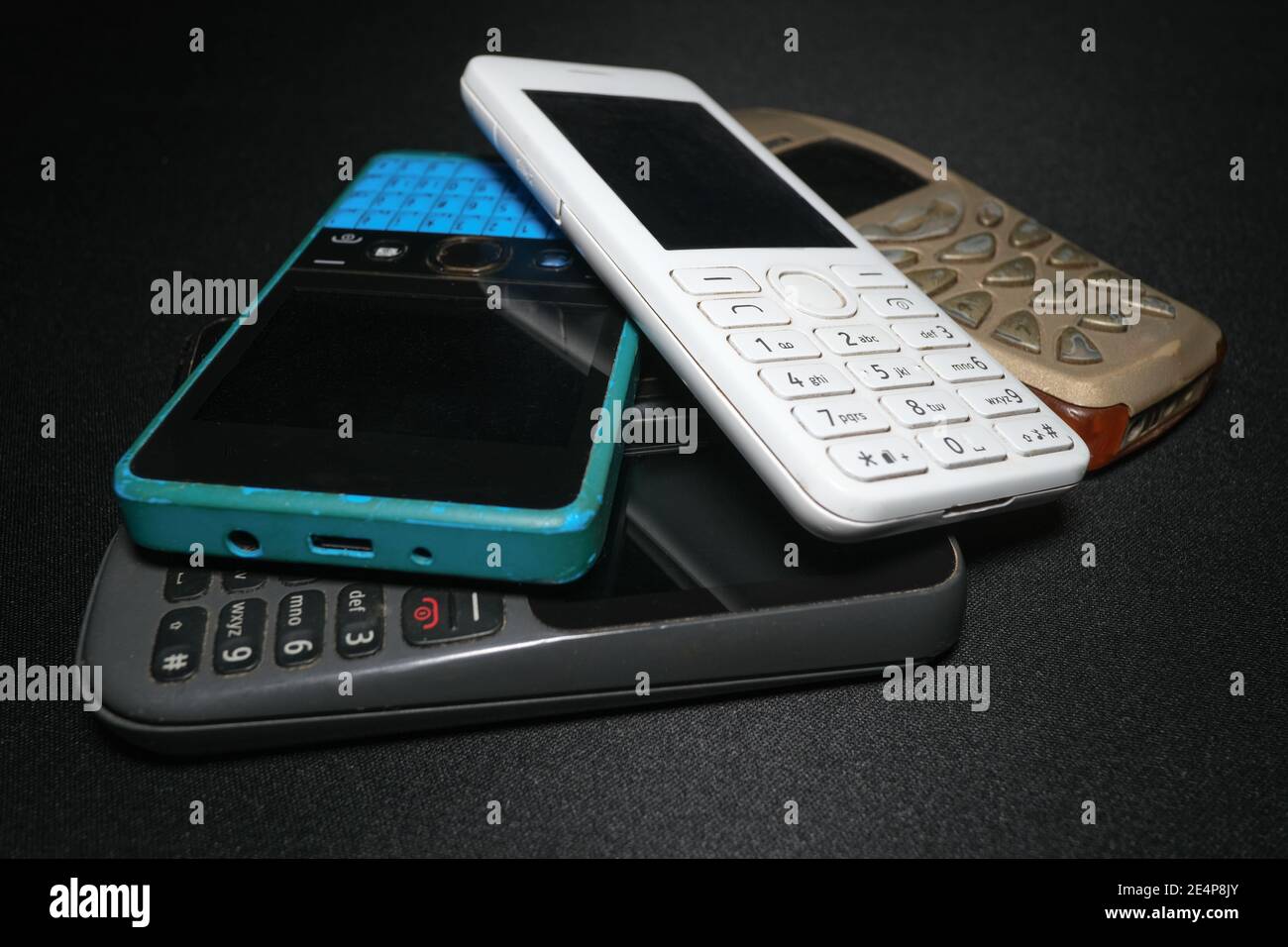 Pile of old gen mobile phones devices,technology evolution concept Stock Photo