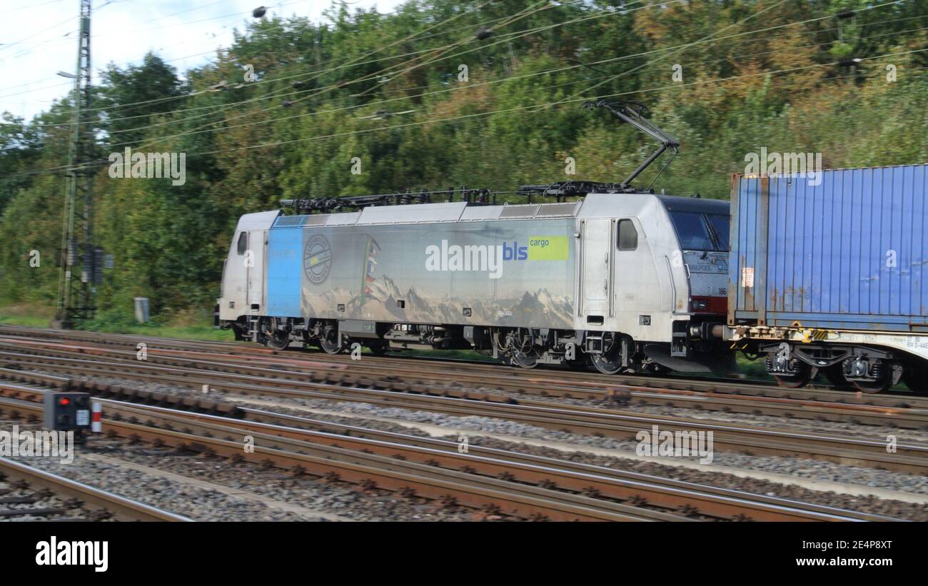 A Traxx Railpool electric powered locomotive with iso container wagons at Cologne-Gremberg, Germany, Europe. Stock Photo
