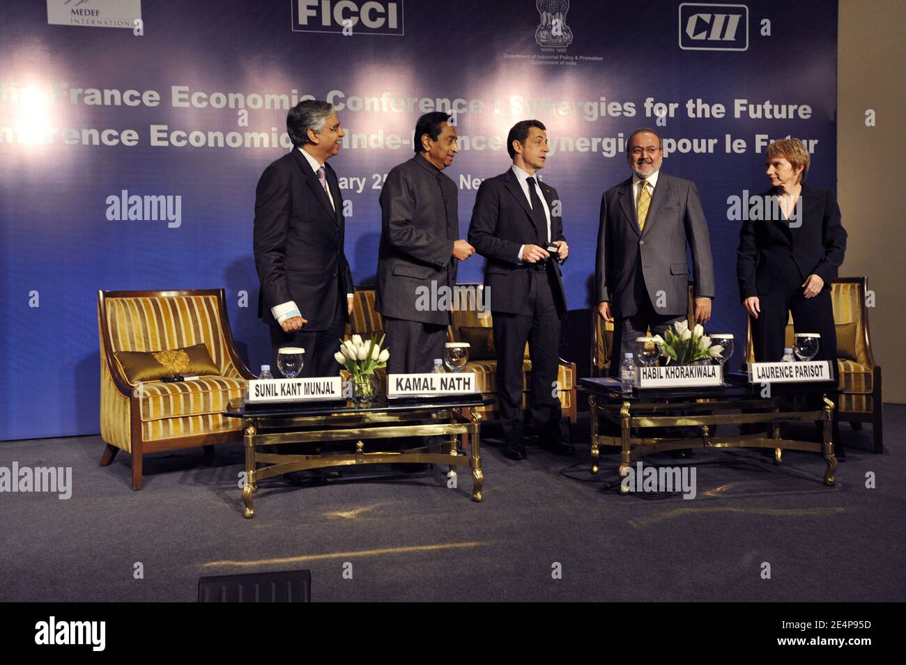 French President Nicolas Sarkozy (C) with Sunil Kant Munjal (L), Past President, CII and Chairman, Hero Corporate Services Ltd and Analjit Singh, Max India Group of Companies, are the other Co-Chairmen, Kamal Nath (2nd from L) Minister of Commerce and Industry, is the Chairman of the event for the fourth consecutive year, while Bhupinder Singh Hooda, Chief Minister of Haryana, will be the Co-Chairman, Habil Khorakiwala (2nd from R) President of FICCI and Laurence Parisot (R) head of the French employer's body MEDEF attend at a France-India economic conference in New Delhi, India, on January 25 Stock Photo