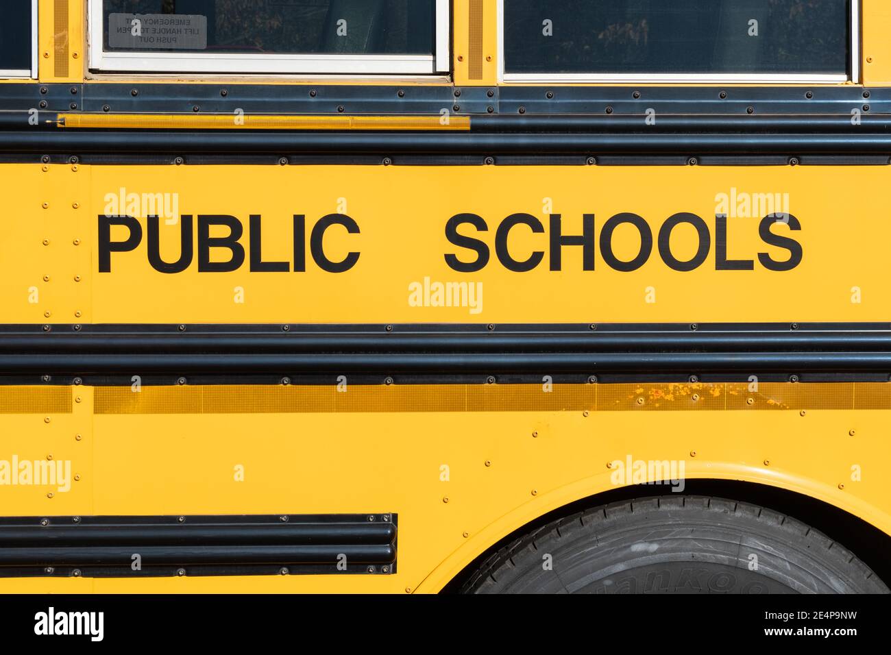 Public schools block lettering on the side of a school bus Stock Photo ...