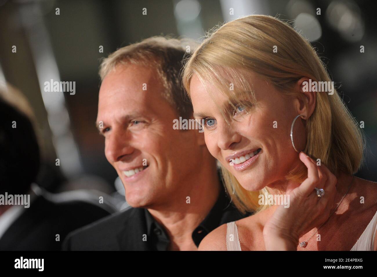 Michael Bolton and girlfriend Nicollette Sheridan attend the premiere