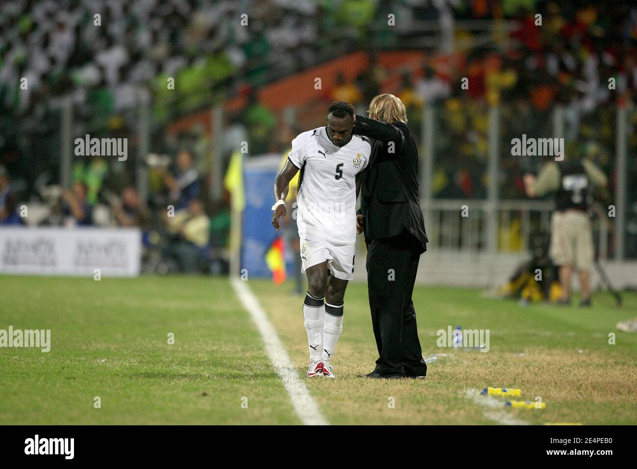 Ghana's Mensah John is congratulated by his coach Claude Le Roy during the African Cup of Nations, quarter finals, soccer match, Ghana vs Nigeria in Accra, Ghana on February 3, 2008. The Ghana won 2-1. Photo by Steeve McMay/Cameleon/ABACAPRESS.COM Stock Photo