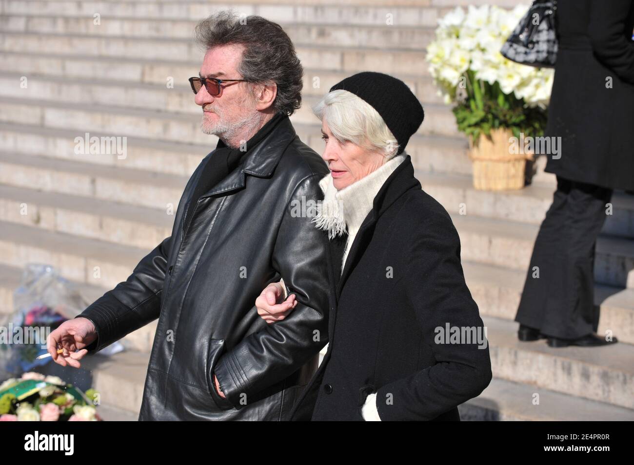 Eddy Mitchell and Francoise Hardy leaving the funeral mass of French singer Henri Salvador at the Madeleine church in Paris, France on February 16, 2008. Salvador died at the age of 90 of an aneurysm at his Paris home on February 13. Photo by ABACAPRESS.COM Stock Photo