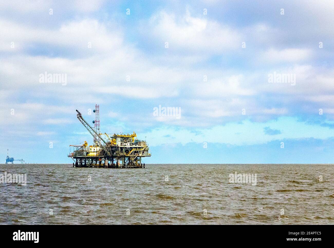 The offshore platform of a natural gas rig is visible from the east end of Dauphin Island, March 4, 2016, in Dauphin Island, Alabama. Stock Photo