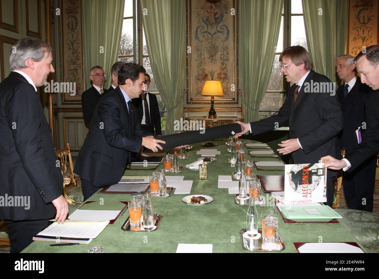 French president Nicolas Sarkozy receives a book by Belgian painter Pierre Alechinsky from Belgium's Prime Minister Guy Verhofstadt during a meeting at the Elysee Palace in Paris, France, on February 20, 2008. Acting Belgian Prime Minister Guy Verhofstadt said on February 19, he will stand down on March 20 to be replaced by the leader of the Flemish Christian Democrats, Yves Leterme. Photo by Alain Benainous/Pool/ABACAPRESS.COM Local Caption 20/02/2008.French President Nicolas Sarkozy meeting with the Belgium s prime minister Pierre Alechinsky at the Elysee Palace Stock Photo