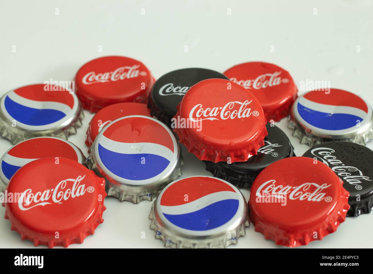 New York, USA - 1 January 2021: Coke bottle caps. Coca-Cola and Pepsi drink logo, Illustrative Editorial Stock Photo