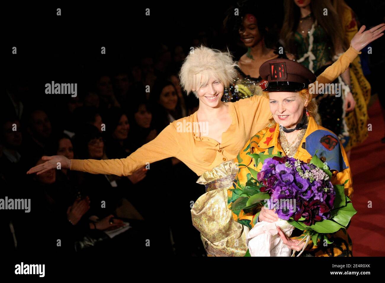 British designer Vivienne Westwood appears with models on