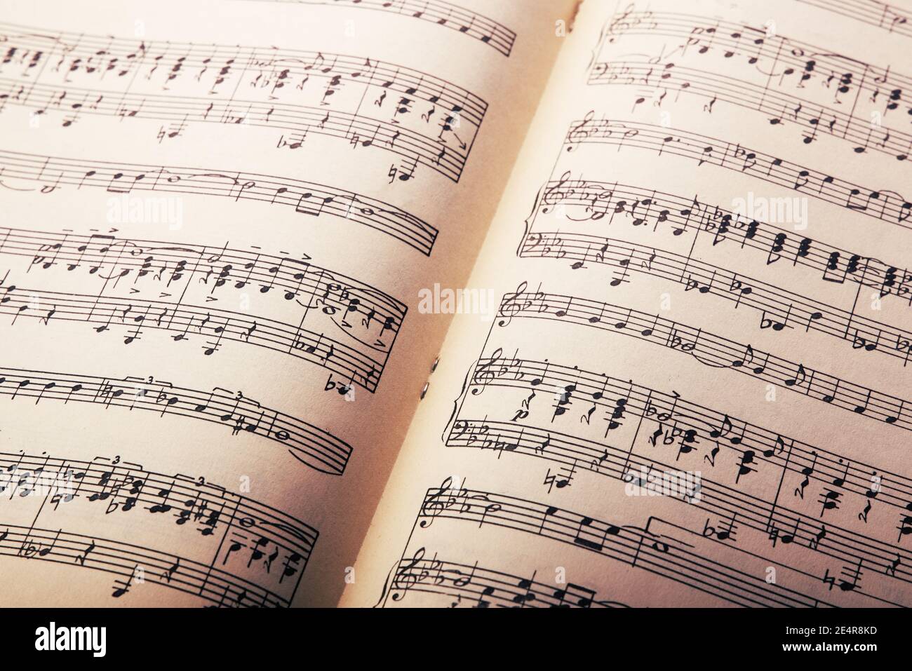 Music notes on old vintage paper background Stock Photo - Alamy