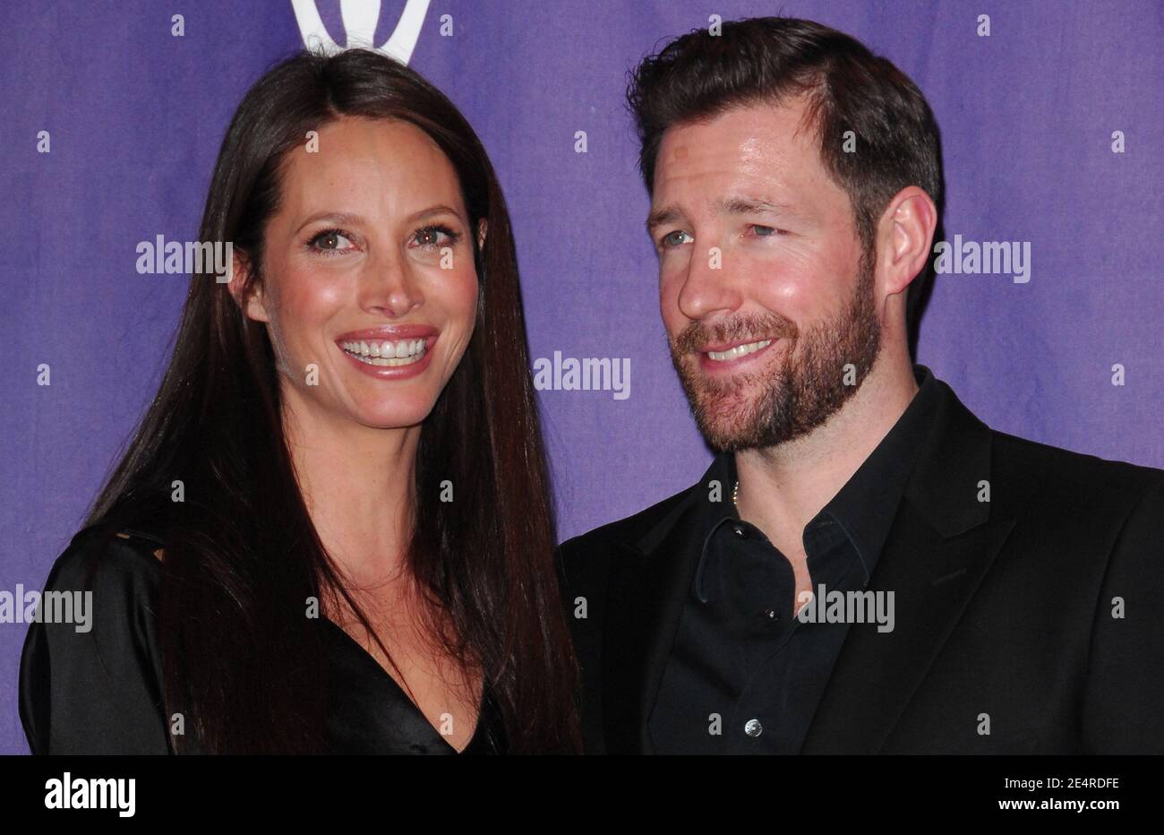 Model Christy Turlington and husband actor Ed Burns pose in the