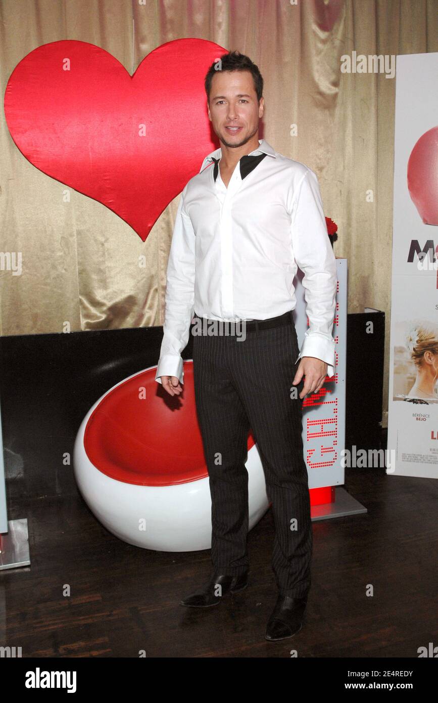 Cast member Stephane Rousseau poses for pictures as he arrives to the