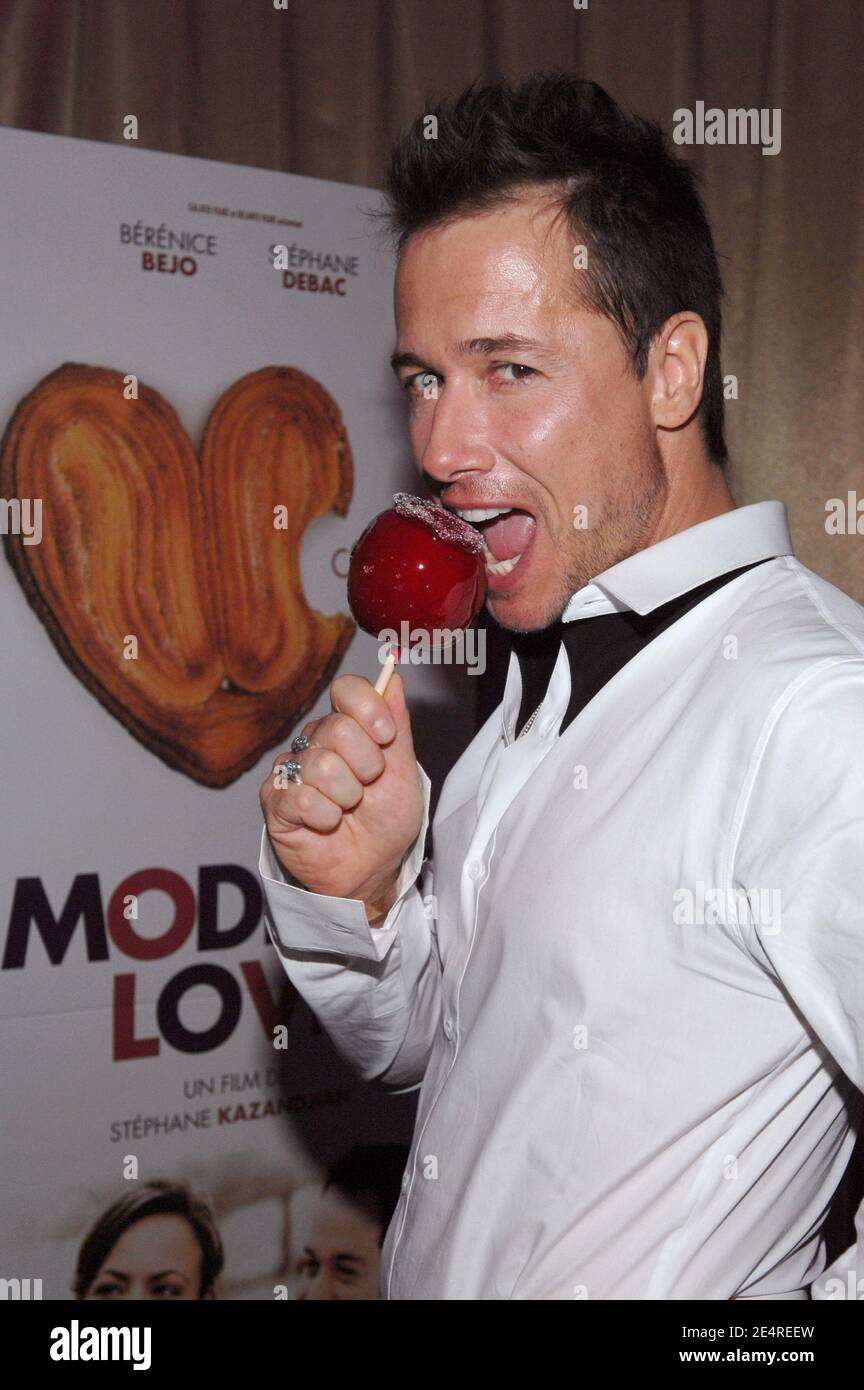 Cast member Stephane Rousseau poses for pictures as he arrives to the