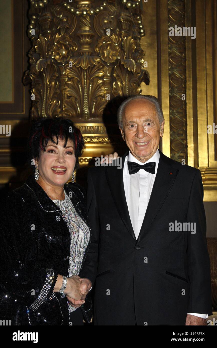 Rika Zarai and Israeli president Shimon Peres attend the Charity gala  organized by 'CARE and Pasteur-Weizmann for the peace in the World' held at  the Opera Garnier in Paris, France, on March