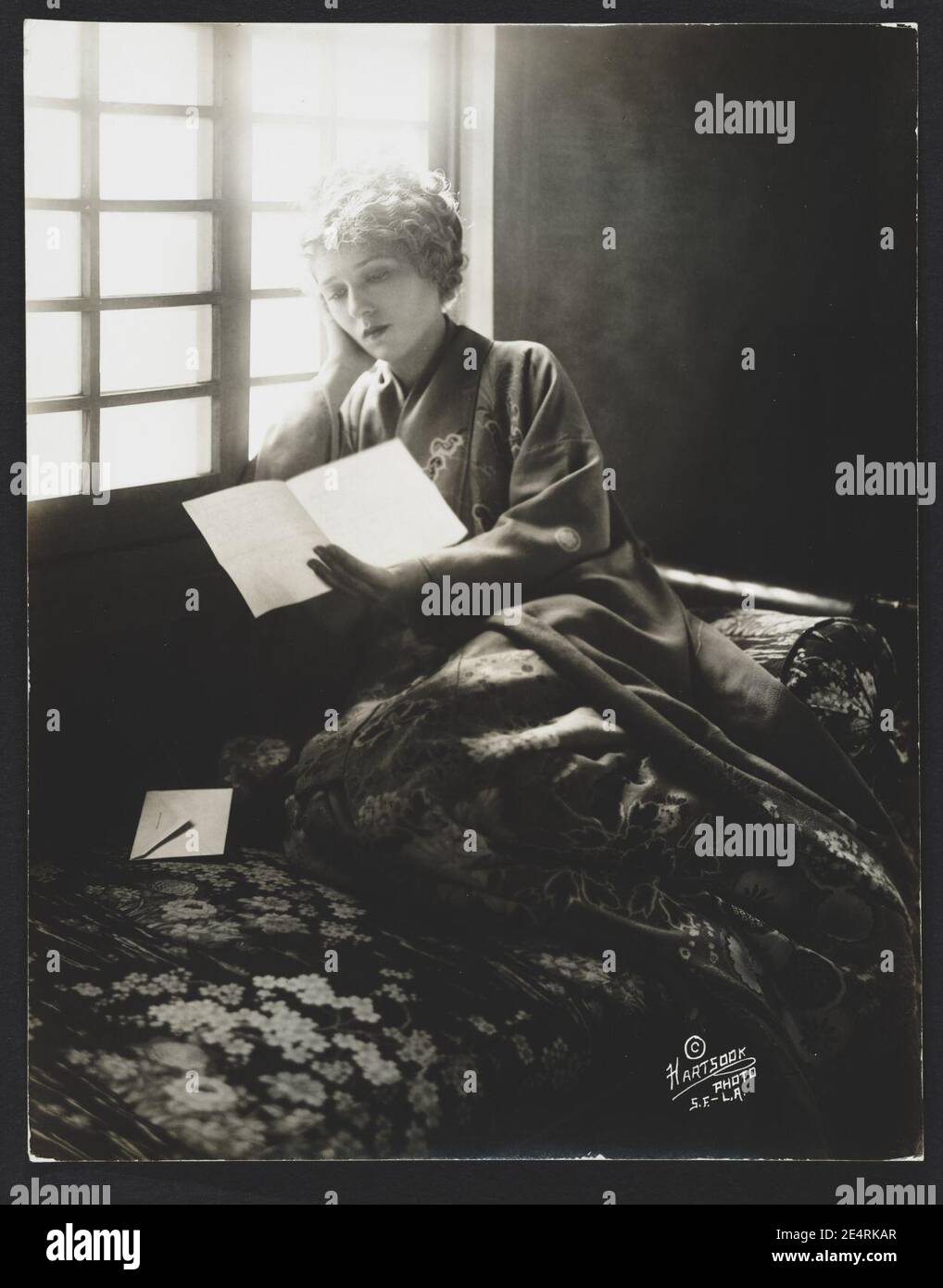 Mary Pickford, wearing a kimono, reading a letter) - Hartsook Photo, S.F. - L.A Stock Photo