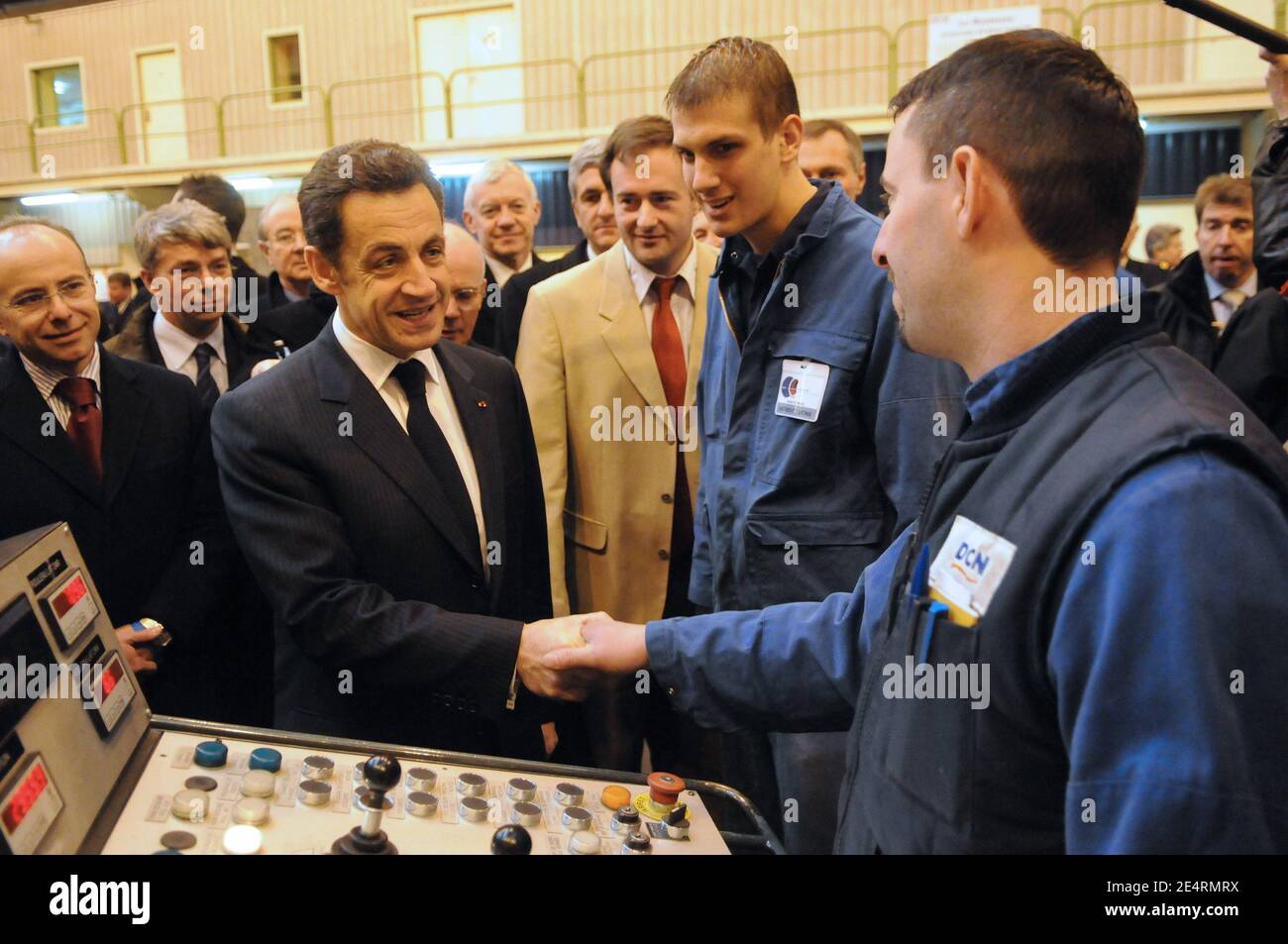 "Jean-Marie Poimboeuf and French President Nicolas Sarkozy talk with workers of French shipbuilder DCNS where the nuclear submarine 'le Terrible' was built in Cherbourg, western France March 21, 2008. President Sarkozy visited France's new generation nuclear-armed submarine""Le Terrible"". Photo by Jacques Witt/Pool/ABACAPRESS.COM" Stock Photo
