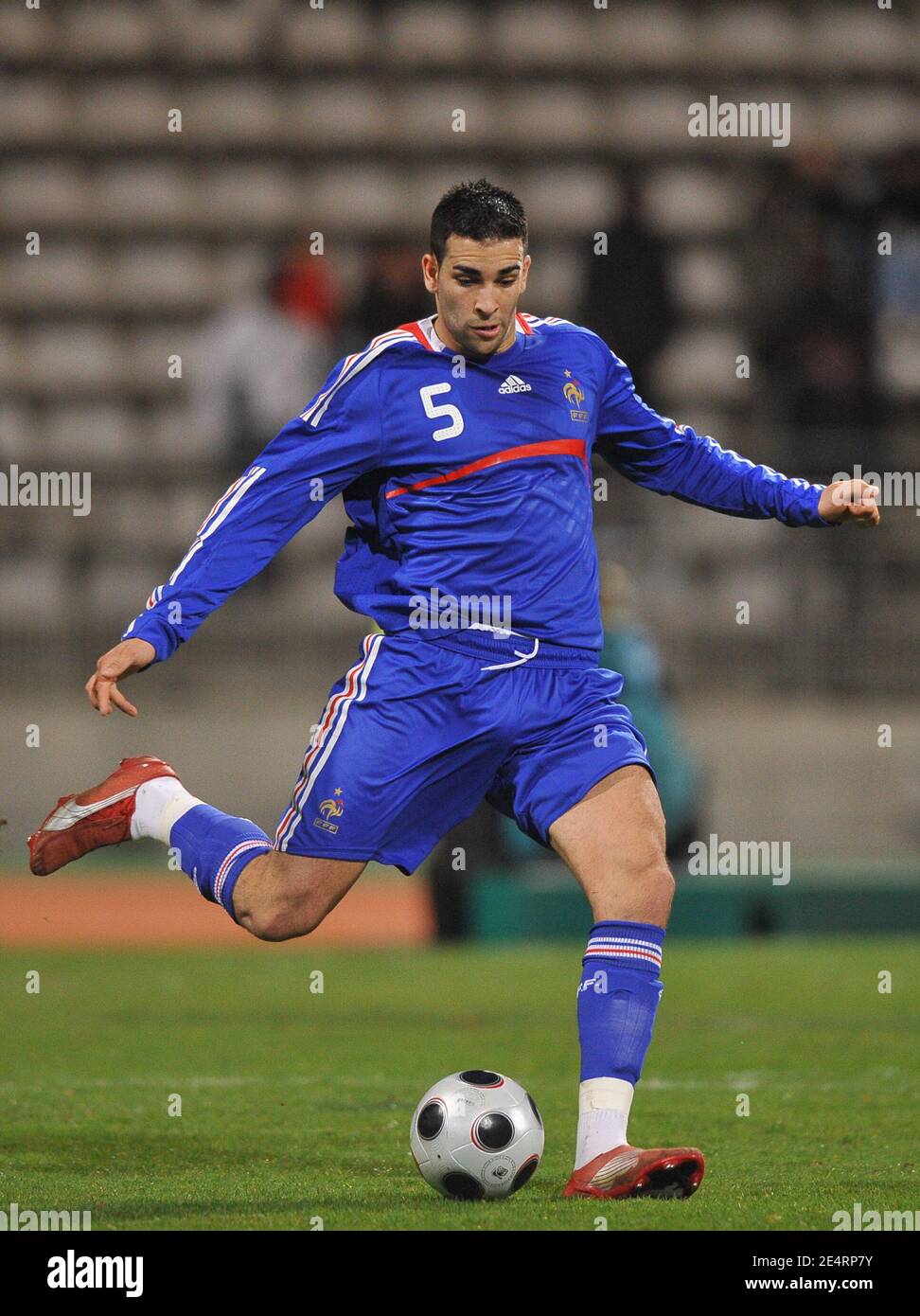France's Adil Rami takes a kick during the friendly soccer match ...
