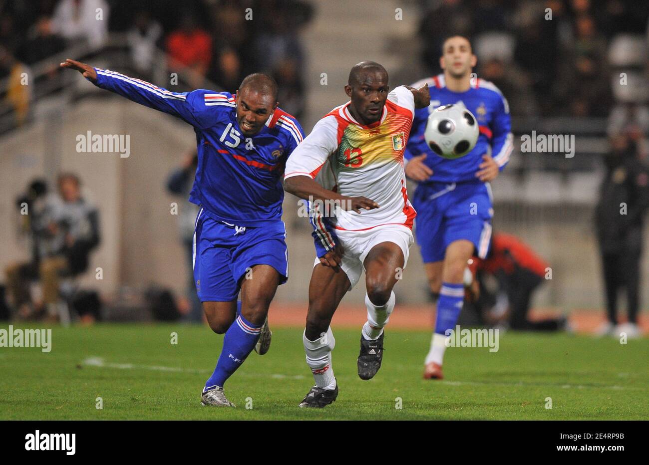 Mali's Mamadou Diallo challenges France's Florent Sinama Pongolle during  the friendly soccer match, France A' vs Mali at the Charlety stadium in  Paris, France on March 25, 2008. France defeats Mali 3-2.