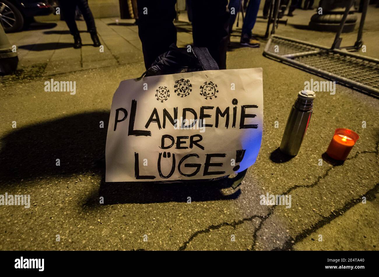 Munich, Bavaria, Germany. 24th Jan, 2021. ''Plandemie'' indicating the belief Corona is a hoax. On the heels of a court win with the Verwaltungsgerichtshof, Markus Haintz of the Querdenken group organized an anti-mask, anti-anti-Corona measure demonstration in front of the Verwaltungsgerichtshof in Munich, Germany. Approximately 250 were in attendance and displayed a jump in radicalization and propensity for violence against media representatives not seen prior to the end of the Trump era. At one point, media representatives were swarmed, physically attacked and prevented from working as Stock Photo
