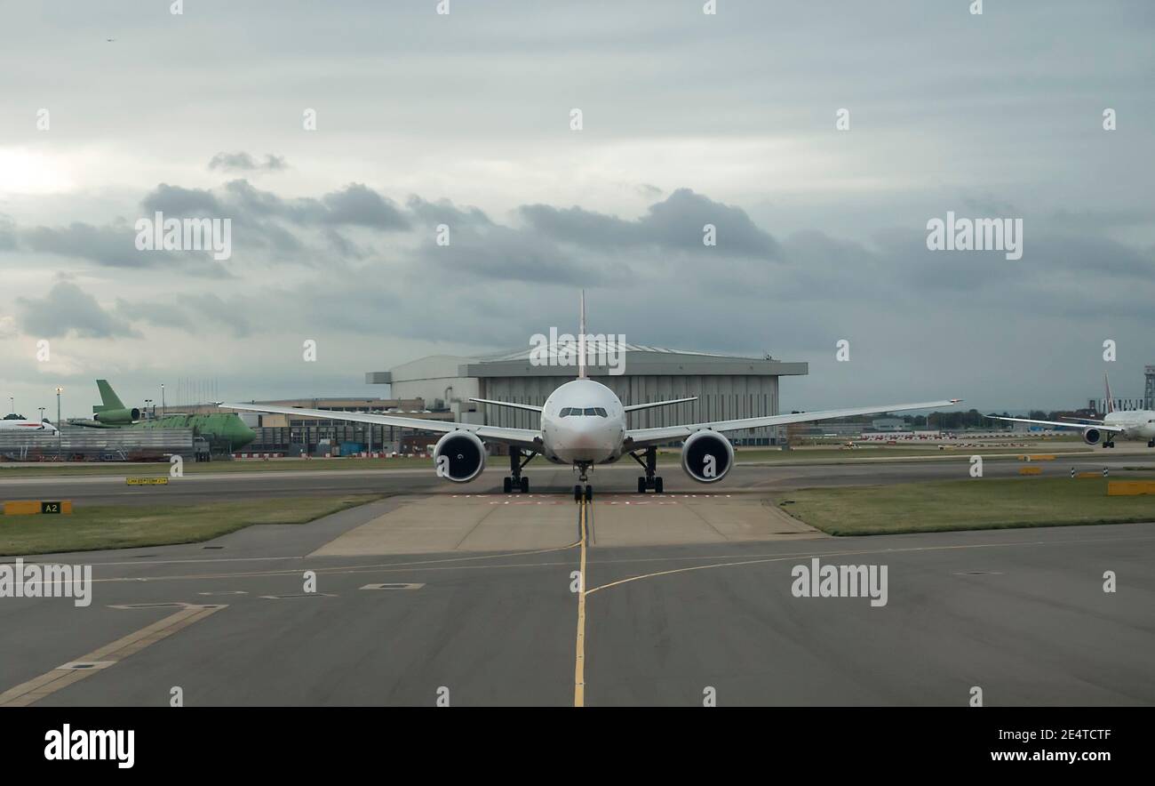 Plane taxiing at airport Stock Photo