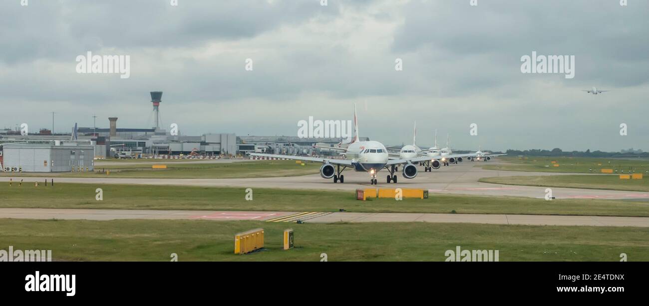 airplanes queueing for take off at airport Stock Photo