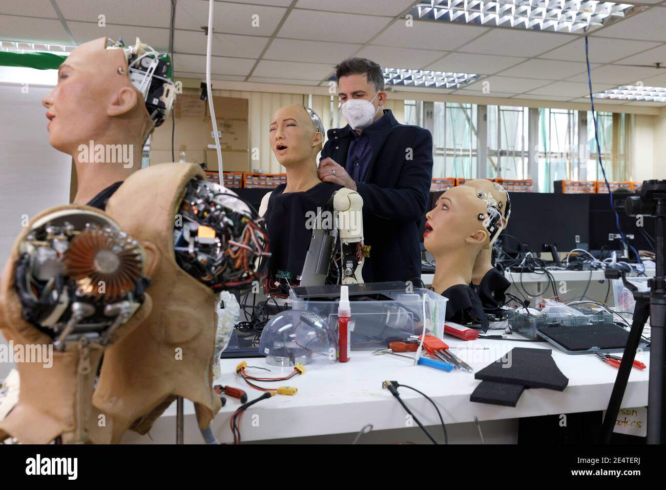 Founder and Chief Executive Officer (CEO) of Hanson Robotics, David Hanson  adjusts a head of a humanoid robot at the company's lab in Hong Kong, China  January 12, 2021. Picture taken January
