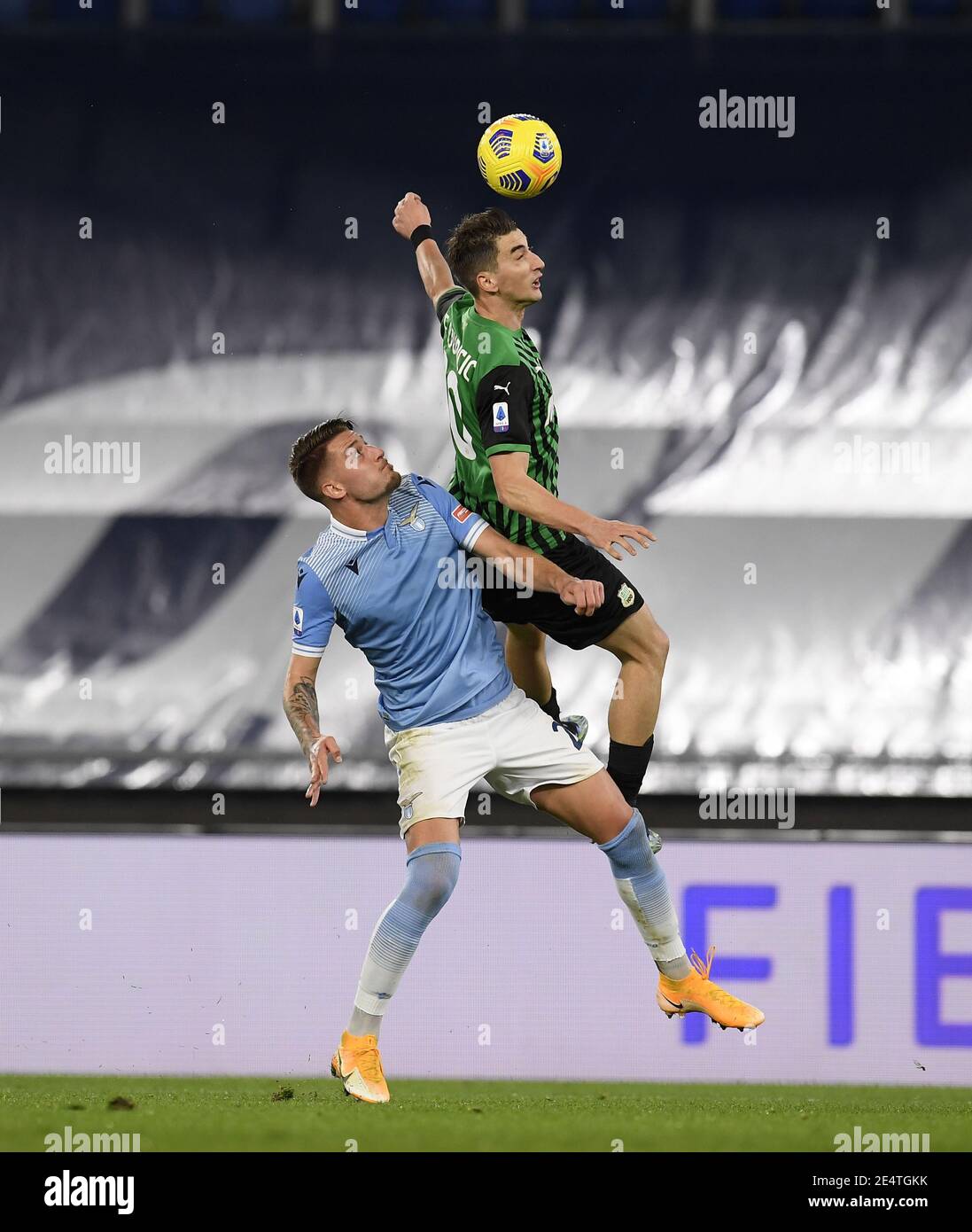 Rome, Italy. 24th Jan, 2021. Lazio's Sergej Milinkovic-Savic (L) vies with Sassuolo's Filip Djuricic during a Serie A soccer match between Lazio and Sassuolo in Rome, Italy, Jan. 24, 2021. Credit: Augusto Casasoli/Xinhua/Alamy Live News Stock Photo