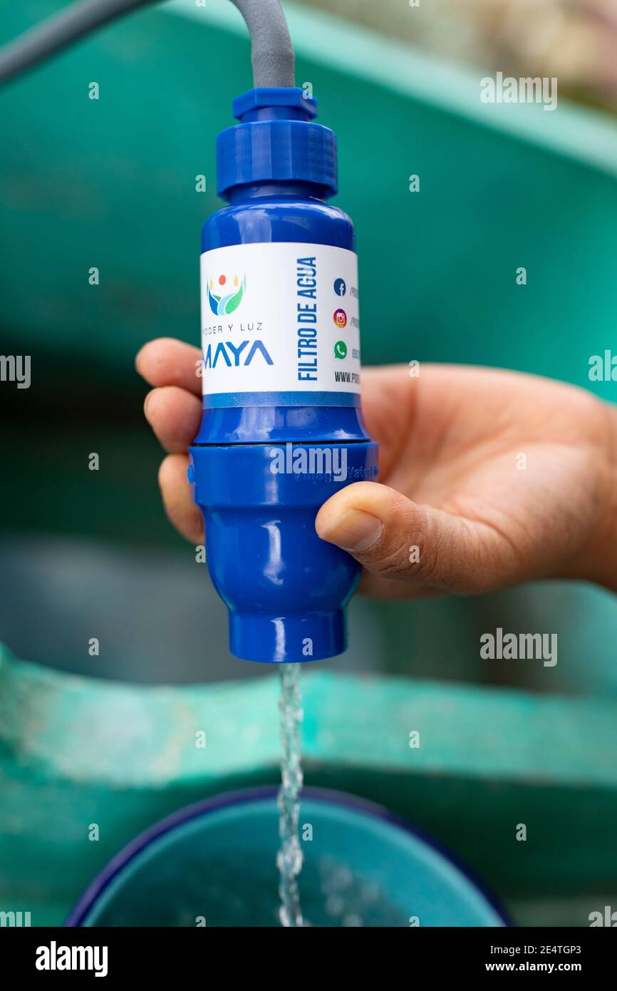 A woman uses a tap-based clean water filtration system at her home in  Cantel, Guatemala Stock Photo - Alamy