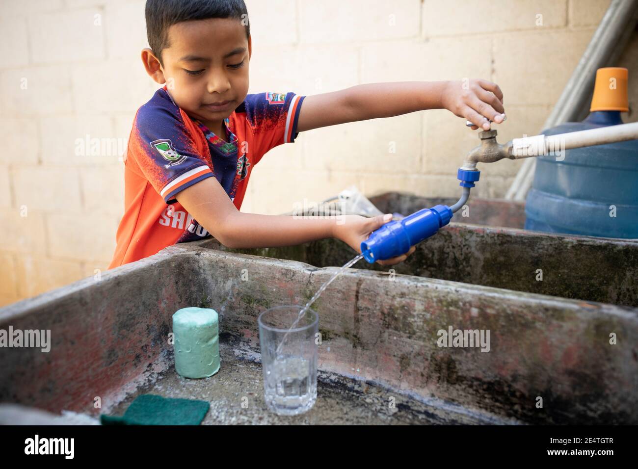 Home tap-based water filter system in use in San Juan la Laguna, Guatemala. Stock Photo