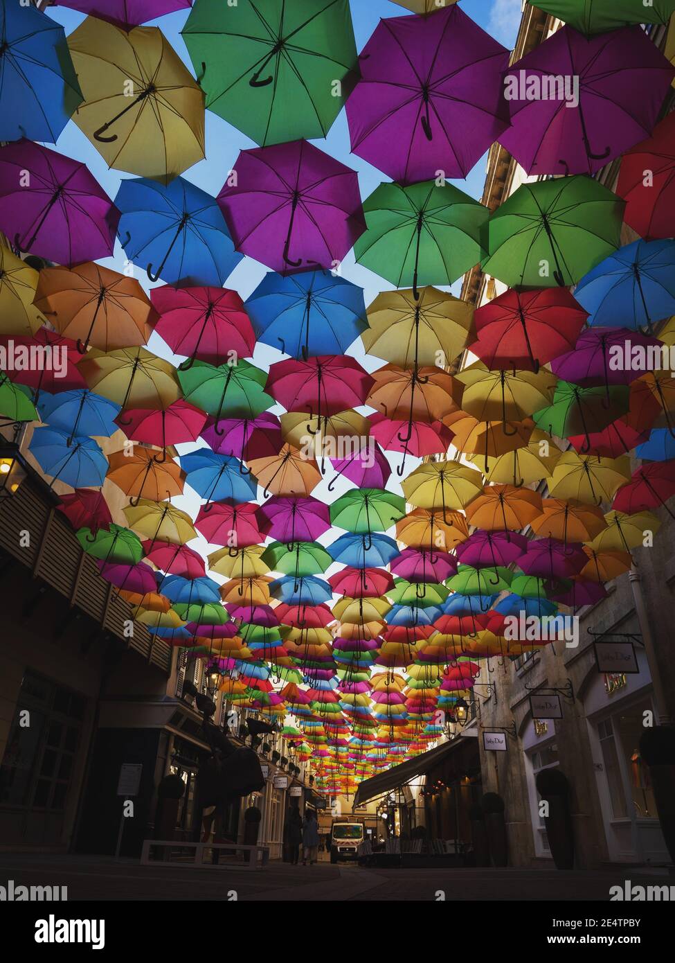 Panorama view of colorful umbrellas sky street decoration art installation  in Cite Berryer Le Village Royal Paris France Europe Stock Photo - Alamy