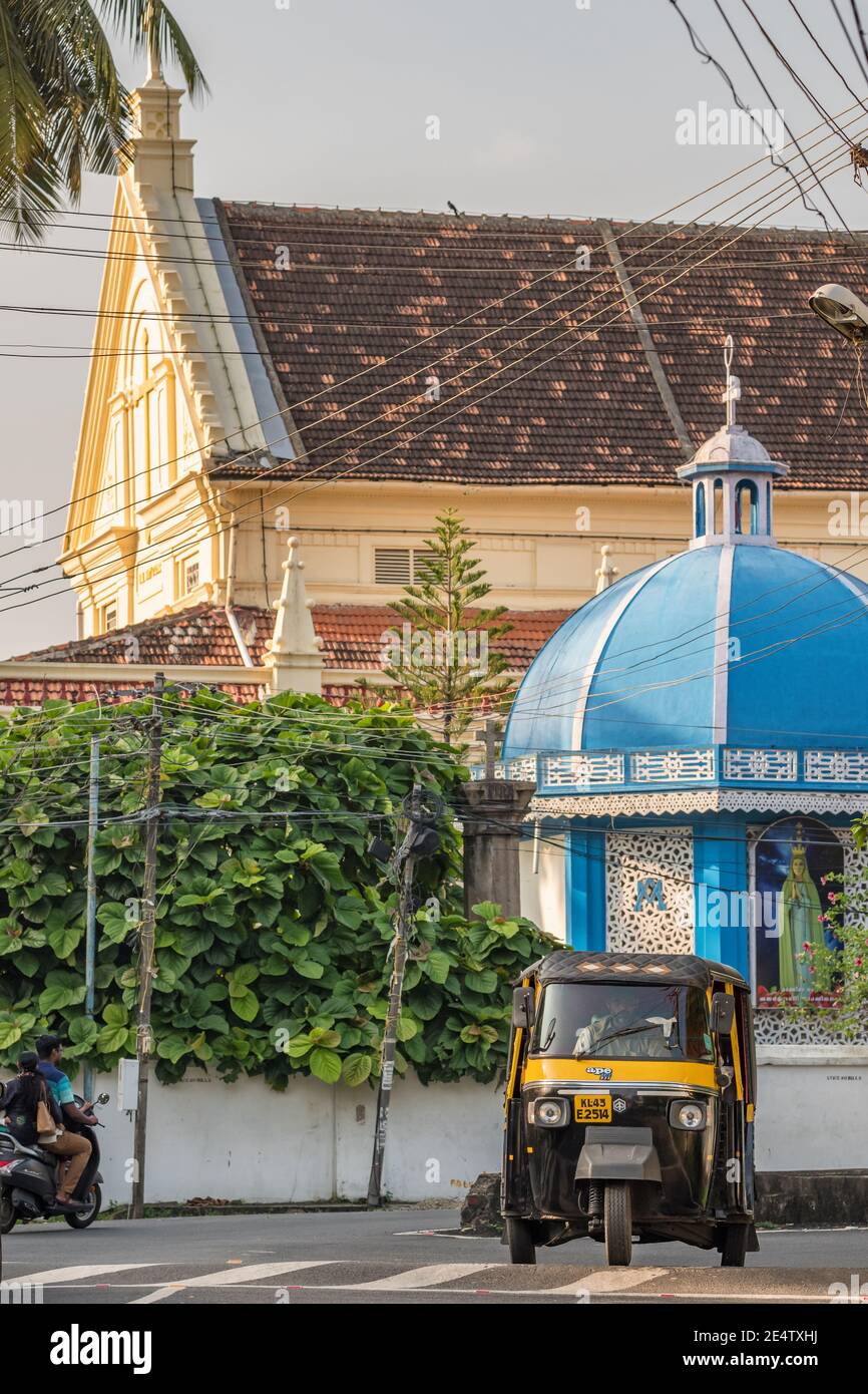 Auto rickshaw and portuguese church at background in Fort Kochi, Kerala, India Stock Photo