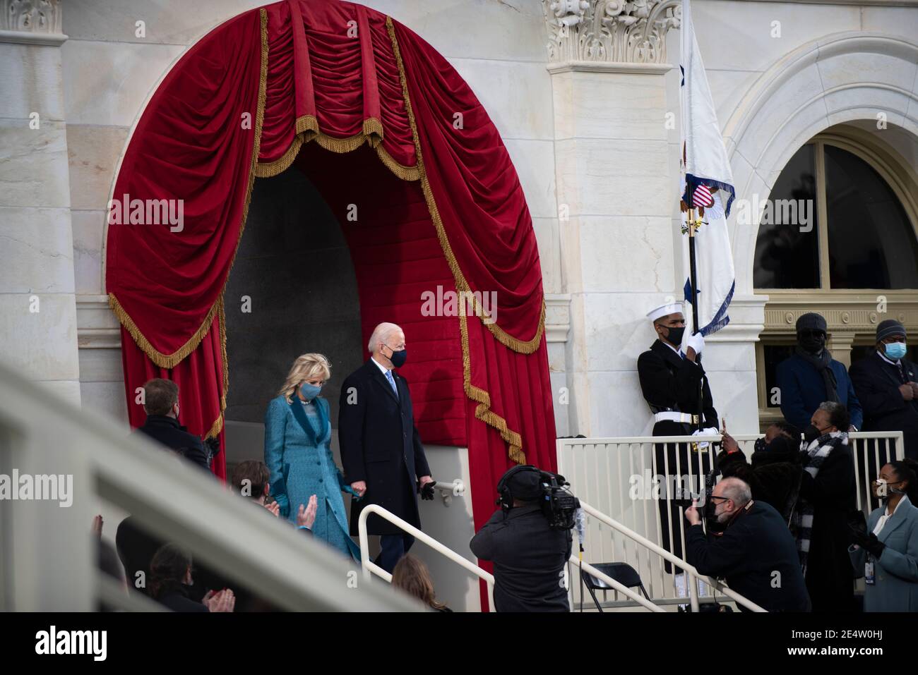U.S. President-elect Joe Biden and his wife Dr. Jill Biden enter the inauguration platform during the 59th Presidential Inauguration ceremony at the West Front of the U.S. Capitol January 20, 2021 in Washington, D.C. Stock Photo