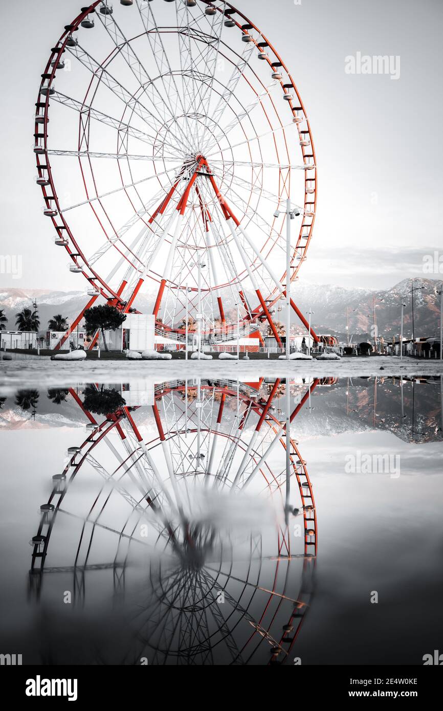 Ferris wheel on a rainy day. Indoor amusement park. Symmetrical ...