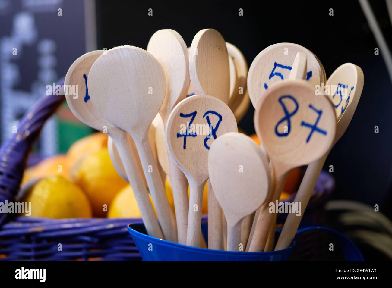wooden kitchen spoons with numbers on them to be handed out to customers while the wait for food order at market booth Stock Photo