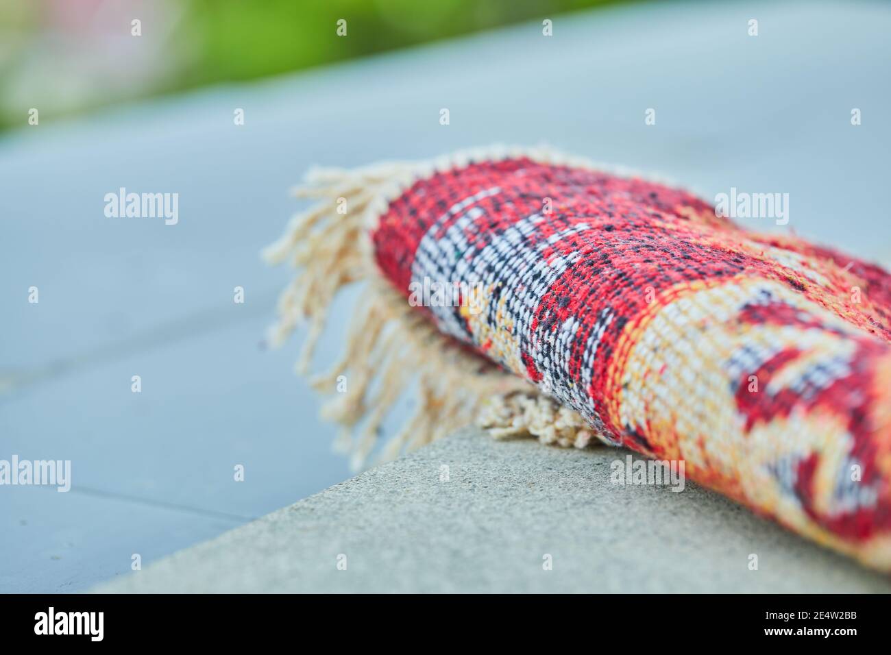 Small carved rug on white background Stock Photo