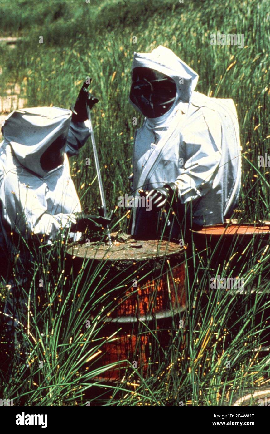 Men in hazmat suits at work Stock Photo - Alamy