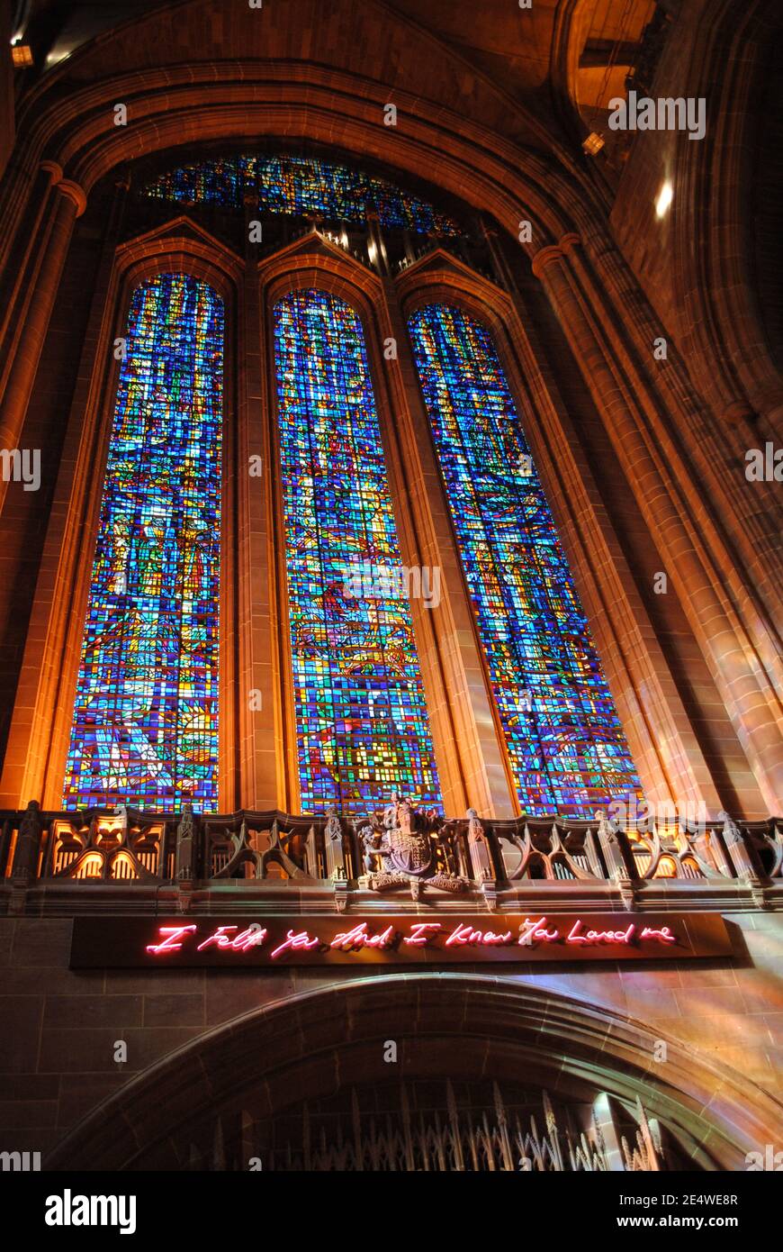 The interior of Liverpool Cathedral including its fine stained glass windows. Stock Photo