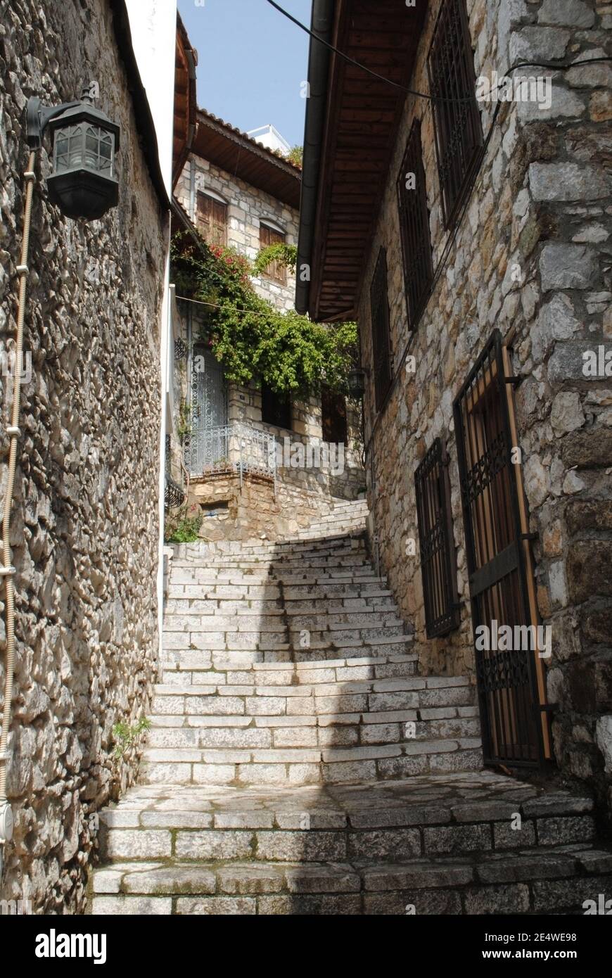 Traditional mediterranean houses and narrow streets in the coastal area of Turkey. Stock Photo