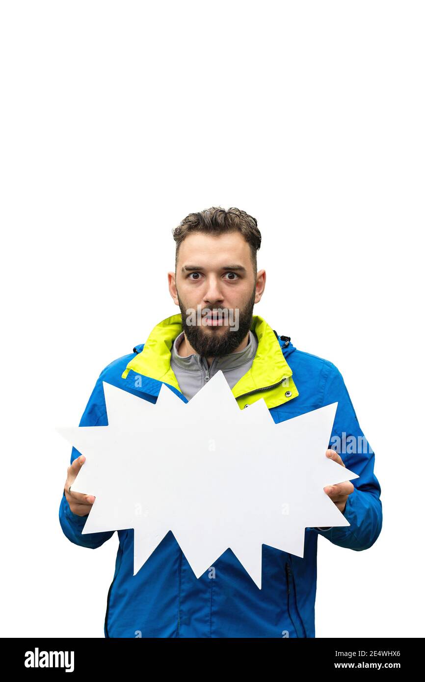 amazed young bearded man holding empty blank board on white background. Stock Photo