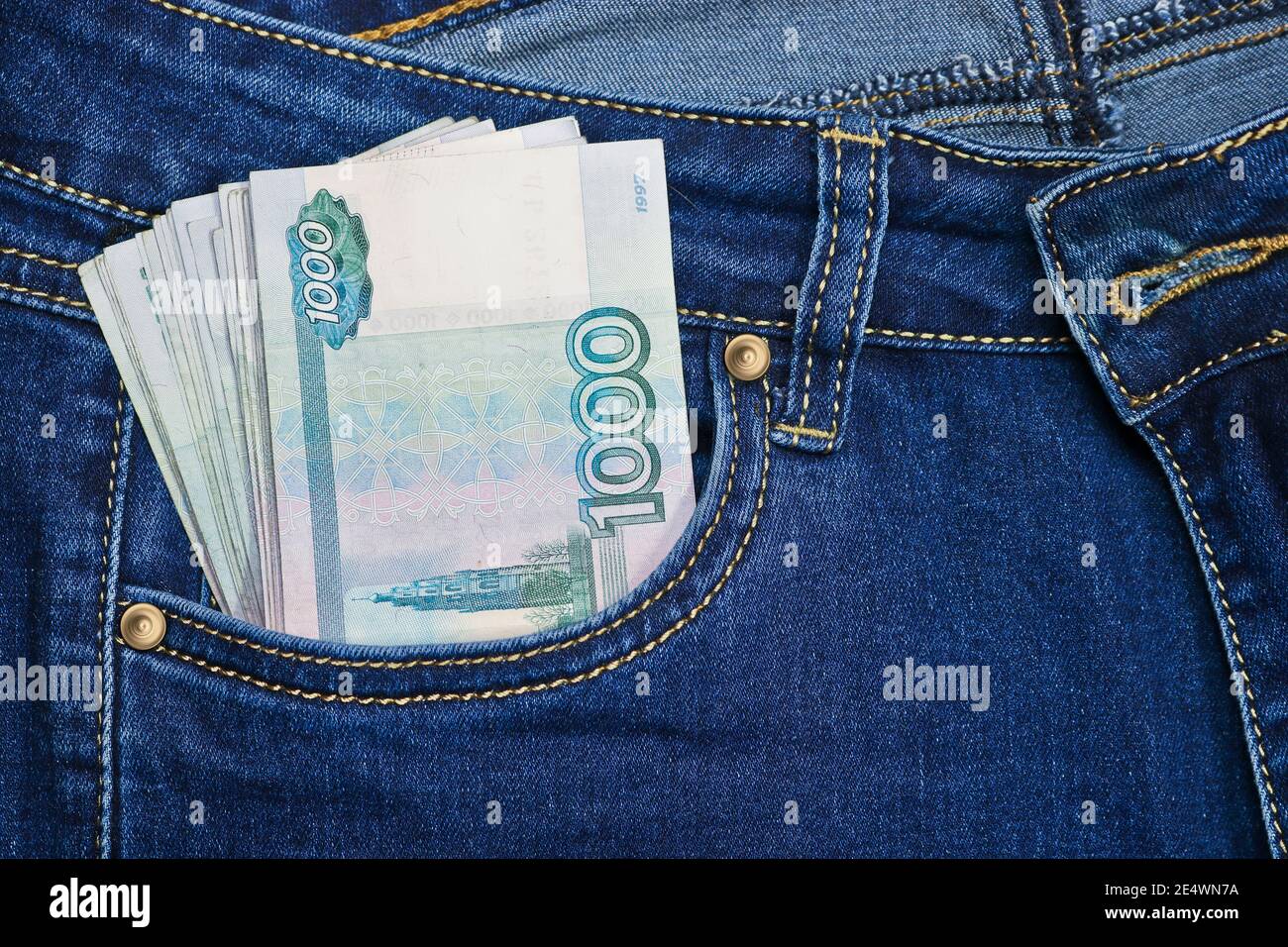 A stack of Russian thousand-ruble bills in a pocket of blue jeans. Money in  your pocket, cash. Travel concept Stock Photo - Alamy