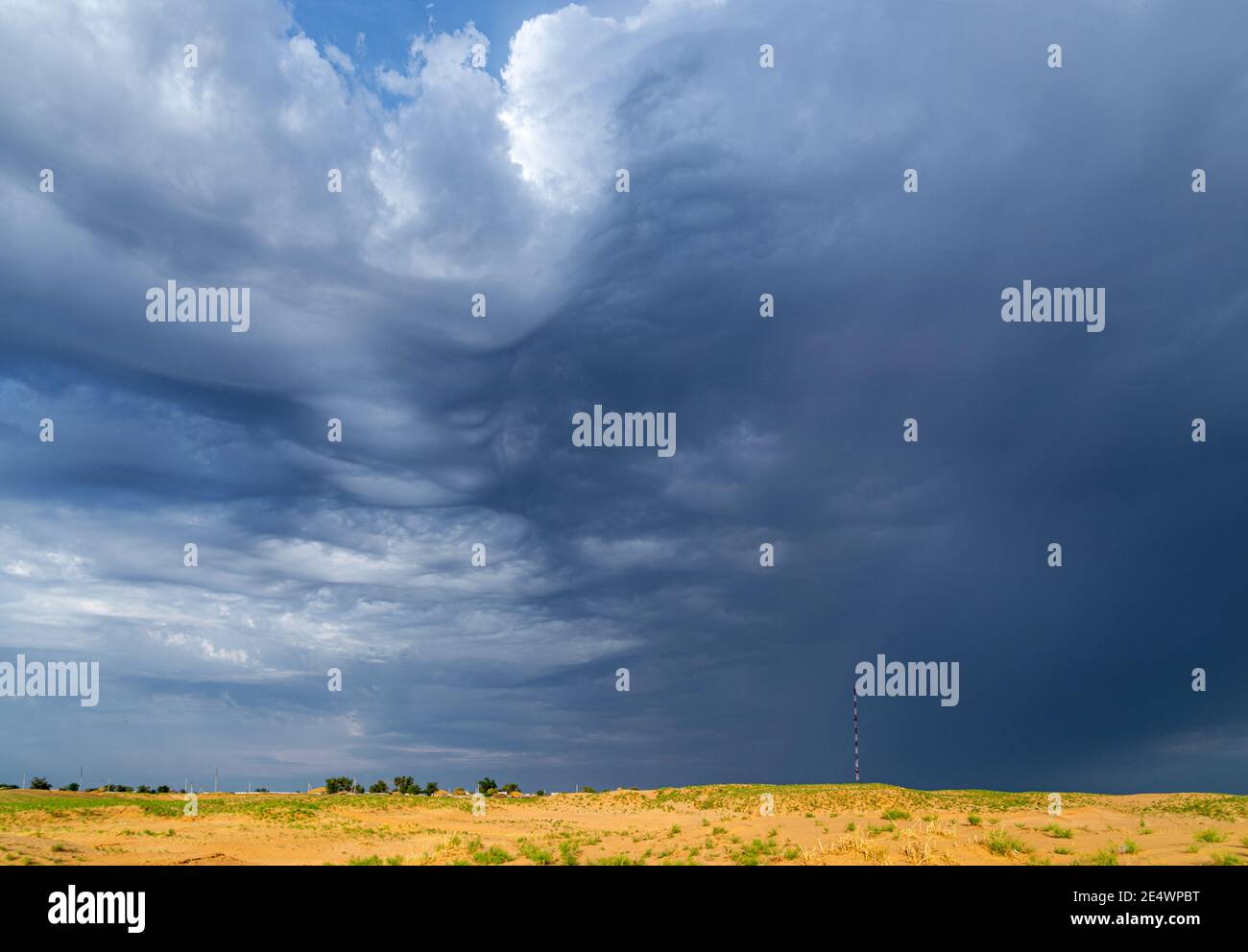 Dramatic stormy sky in desert before thunderstorm. Stock Photo