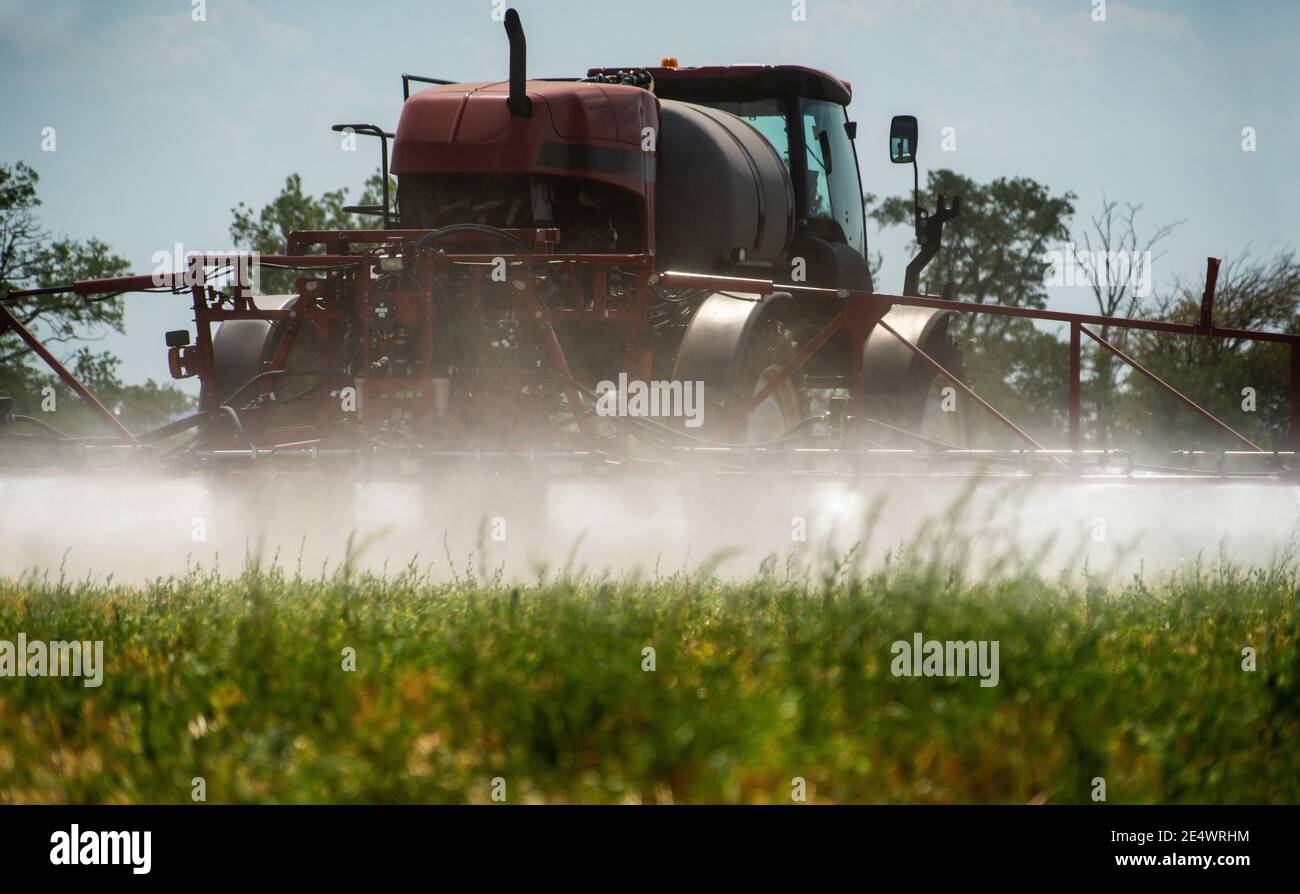 Machine Sprayng Insecticides Machine for spraying pesticides and herbicides on the field Stock Photo ...