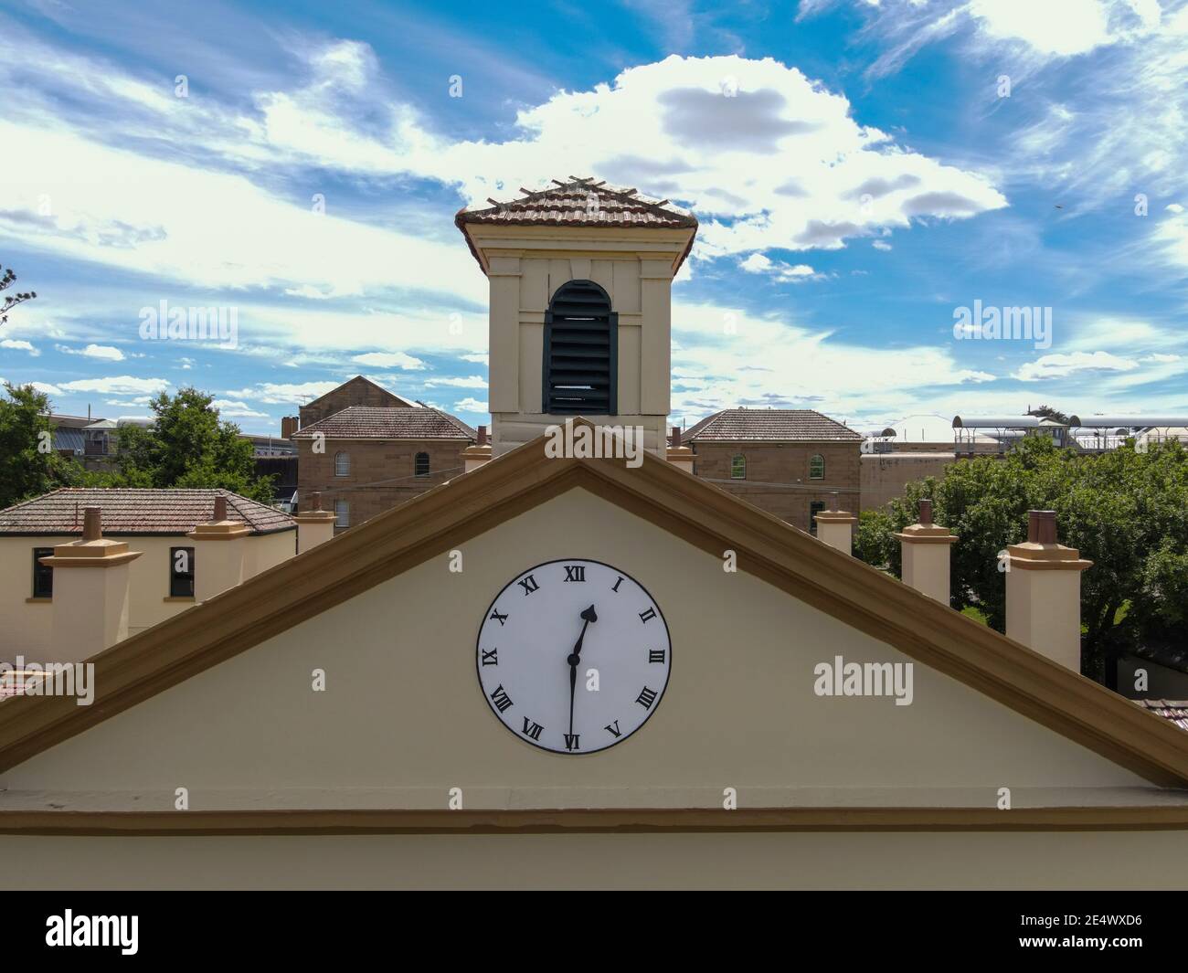 Old East Maitland Court House With Exterior Columns, Clock and Bell Tower in front of Old East Maitland Goal Stock Photo