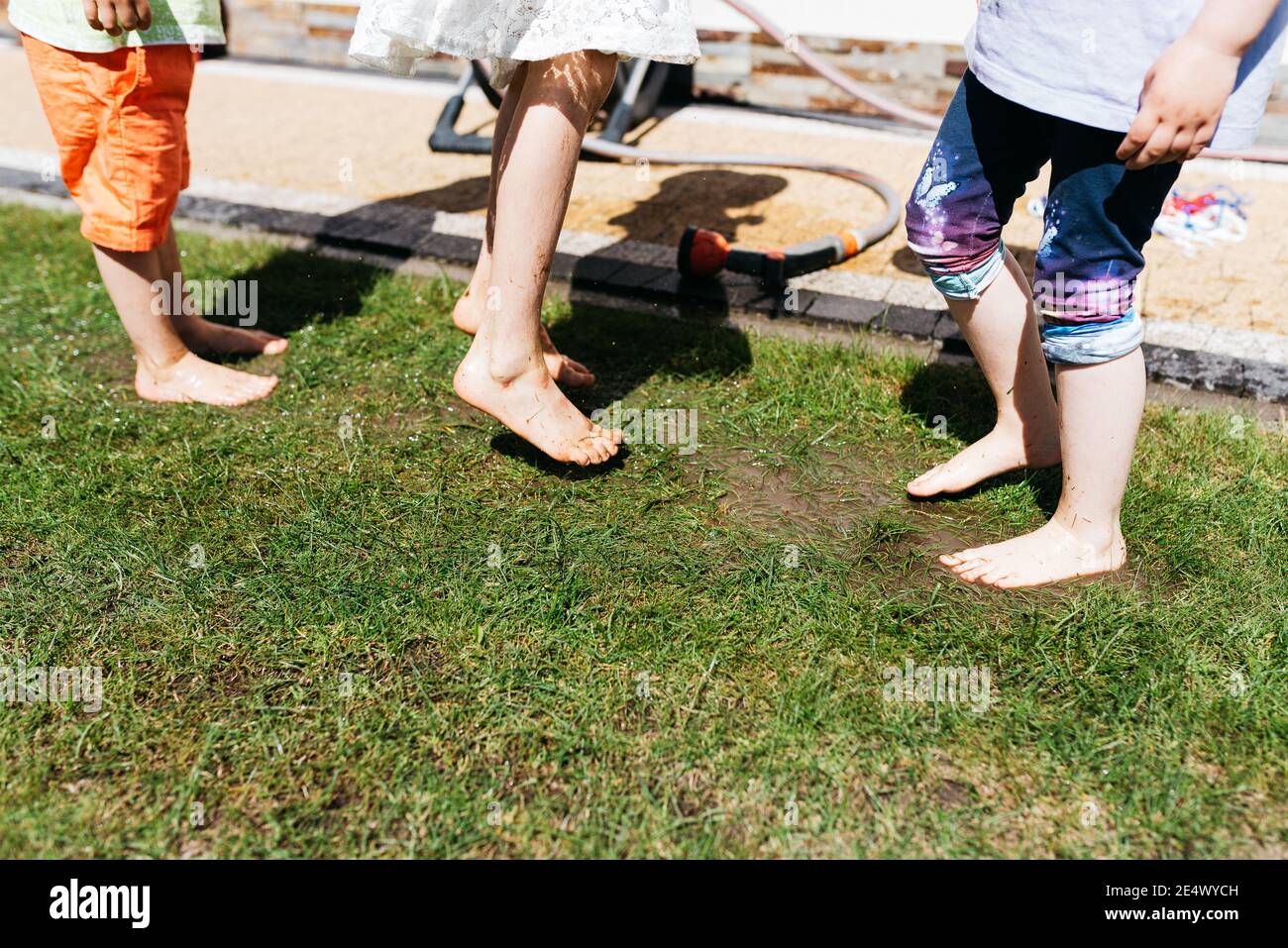 Kids jumping puddle hi-res stock photography and images - Alamy